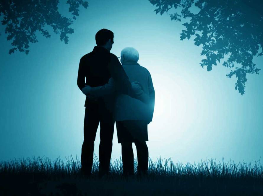 Elderly person and adult child hugging, symbolizing family reunification for parents.