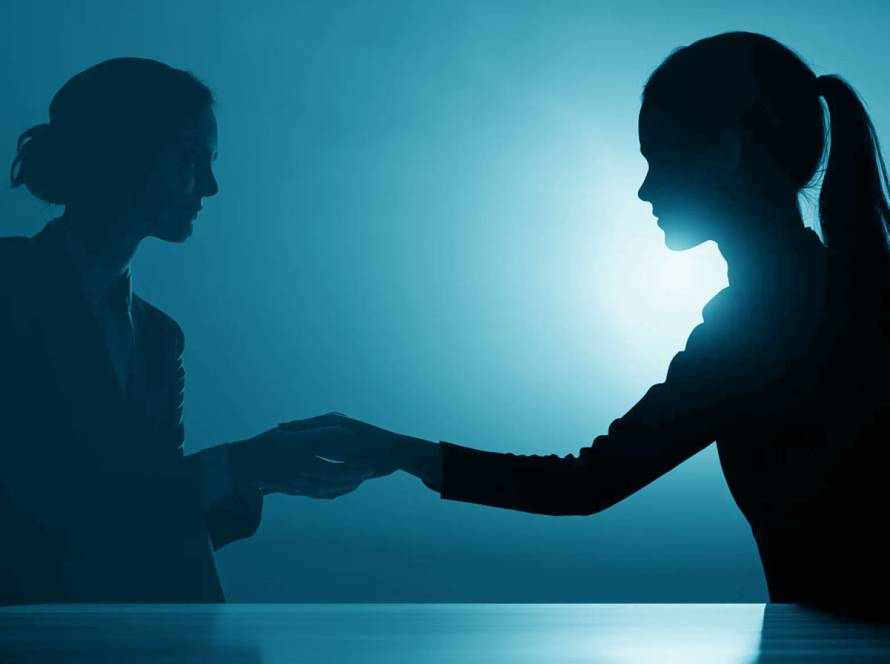 A woman seeking protection, symbolizing support and legal relief under the Violence Against Women Act (VAWA) program.